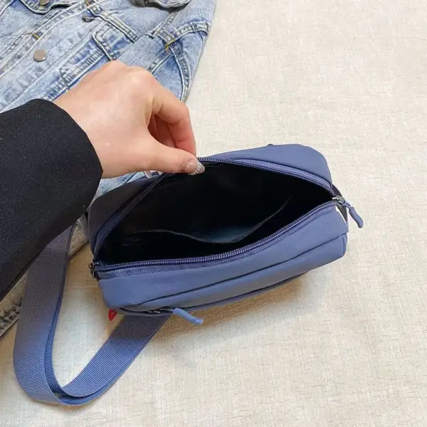 Bauchtasche Grau Damen, kompakt mit schrägem Reißverschlussfach – Bild 3